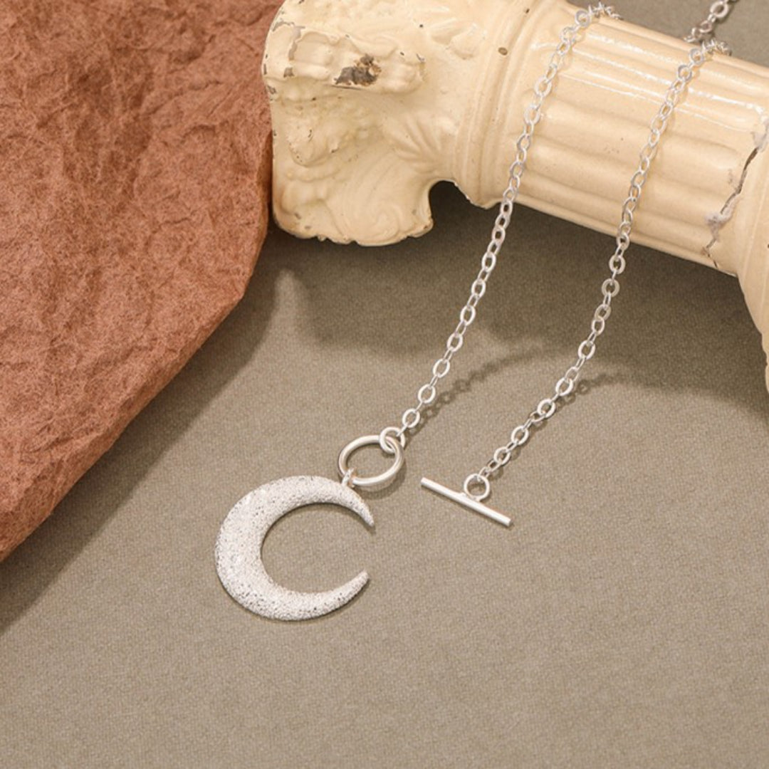 Maanverlichte charm ketting